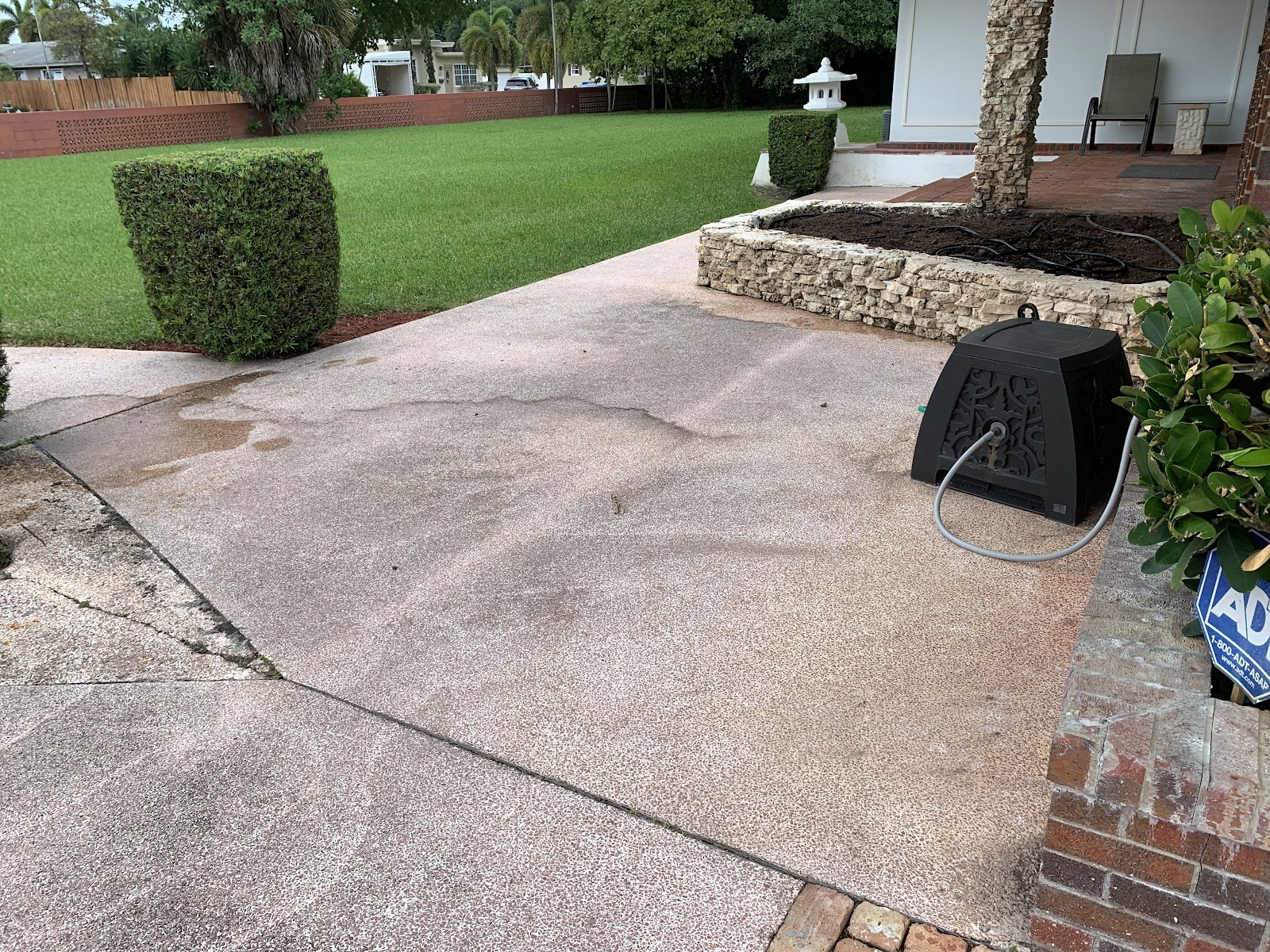 Backyard patio and lawn edge, freshly washed